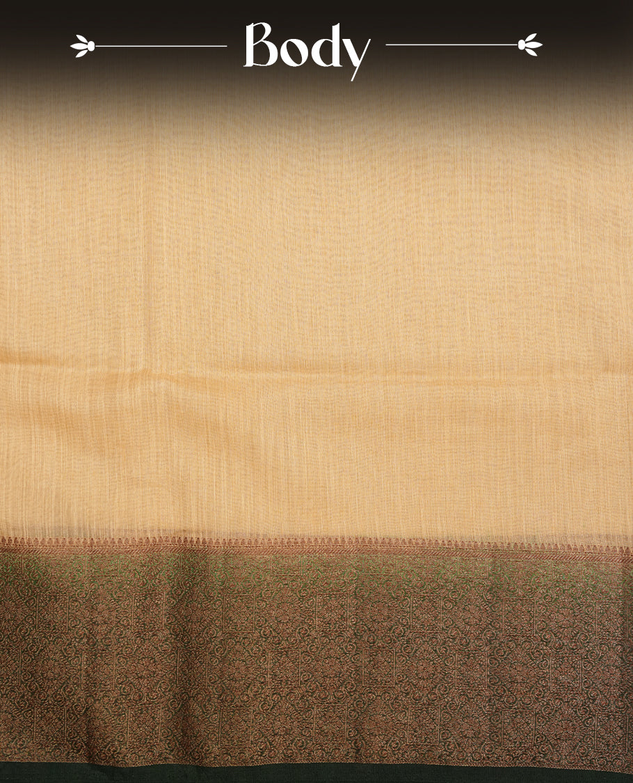 Light gold colour semi linen silk saree featuring elegant plain body, highlighting antique zari traditional border with contrast green colour, pallu and paired with matching blouse