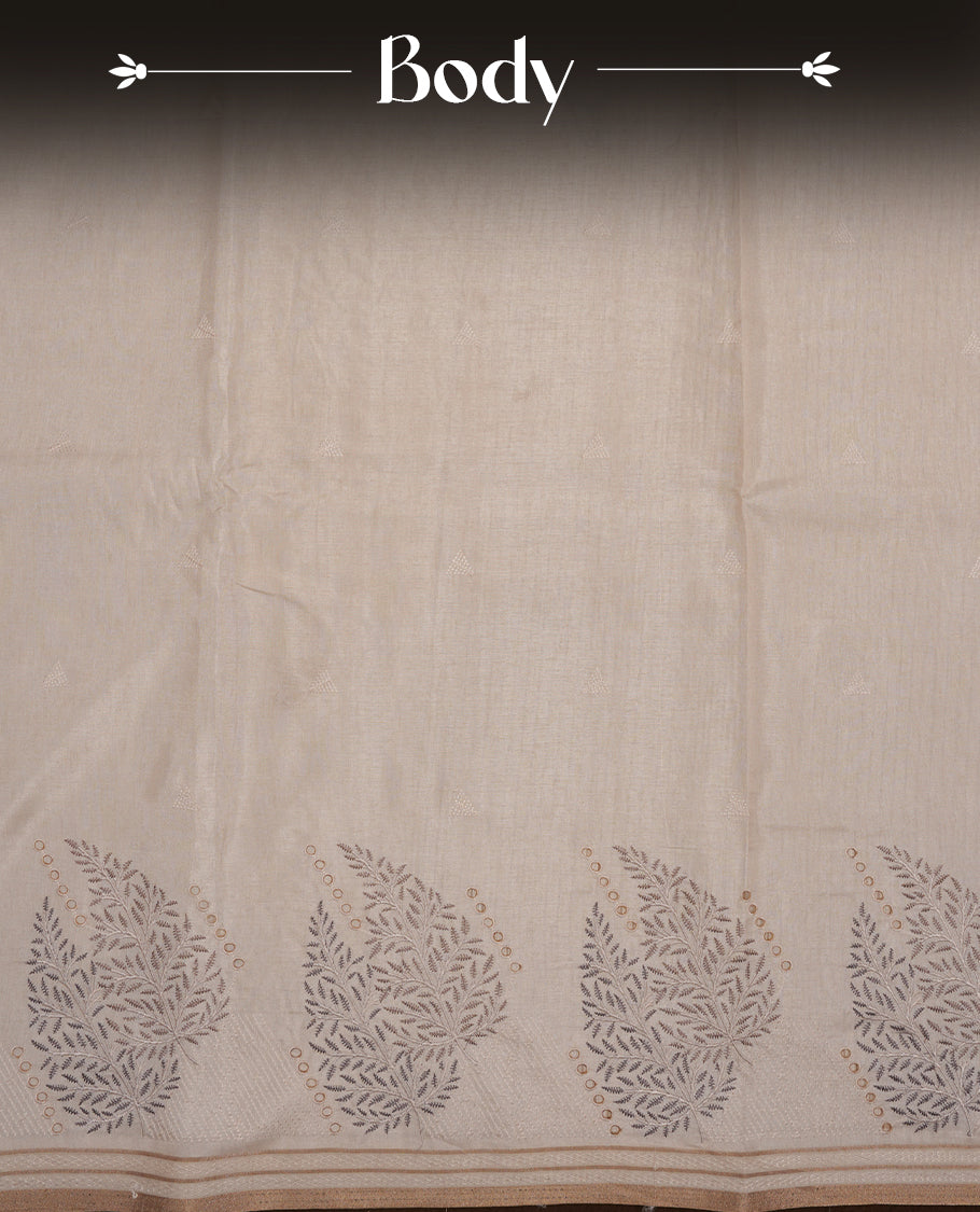 Beige colour Tussar silk saree featuring Elegant plain body, highlighting Grey colour Leaf cut work with Light gold zari border, pallu and paired with matching blouse piece.