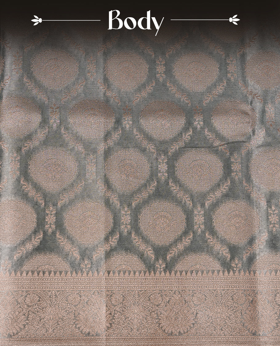 Pastel Blue colour semi tissue silk saree featuring floral zari motifs on body, complemented by gold zari traditional border, paired with matching blouse piece.