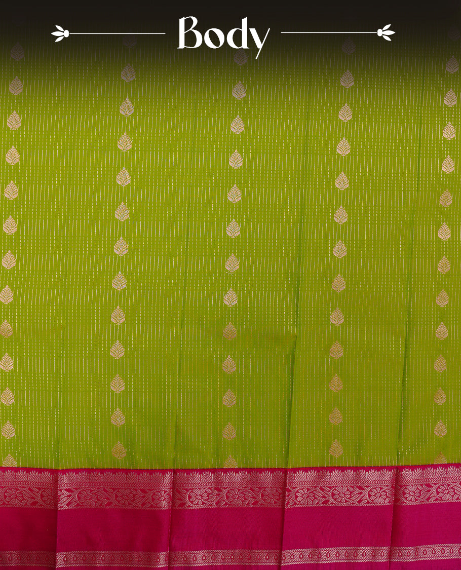 Lemon coloured soft silk saree featuring gold zari stripes and motifs across the body, enhanced with a contrast rani pink border and pallu, paired with a matching contrast blouse piece