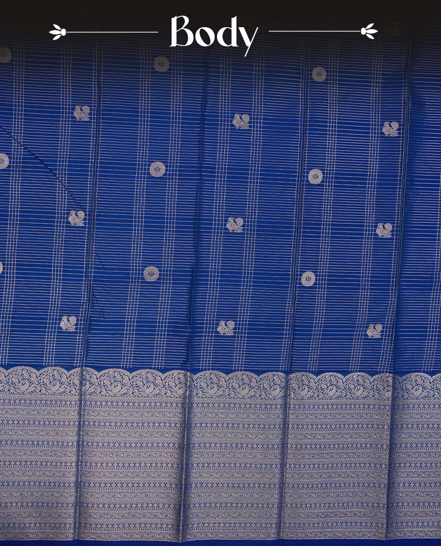 Blue coloured soft silk saree featuring Rose gold zari stripes and motifs across the body, enhanced with a Self colour with traditional border and pallu, paired with a matching blouse piece