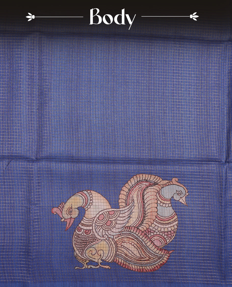 Blue colour semi-tussar silk saree featuring intricate peacock motifs on the pallu, subtle zari check pattern across the body, floral vine prints throughout, finished with tassels and paired with a matching printed blouse piece.