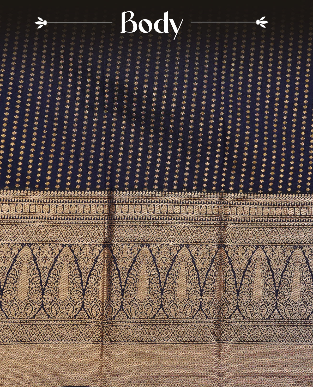 Dark navy blue colour soft silk saree featuring gold zari buttas on body, contrast self colour gold zari motifs on border, grand pallu comes with matching blouse piece.