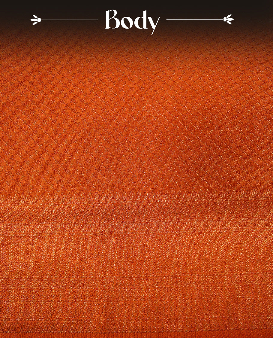 Orange colour softie silk saree featuring dotted stripes across body, complemented by self colour with traditional border, paired with matching blouse piece.