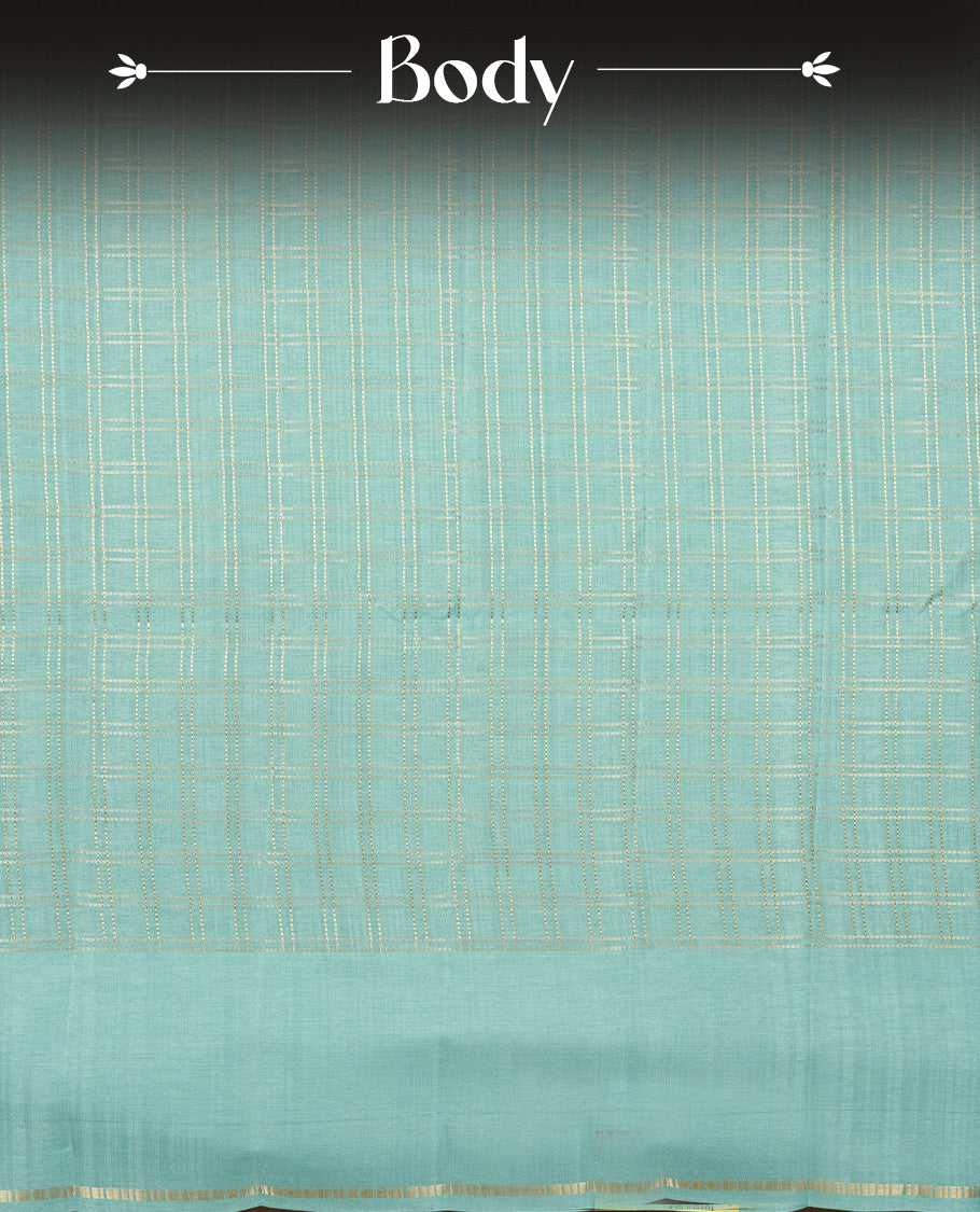 Powder blue colour semi Tussar saree highlights gold zari check pattern across body, border, pallu and paired with matching blouse piece.