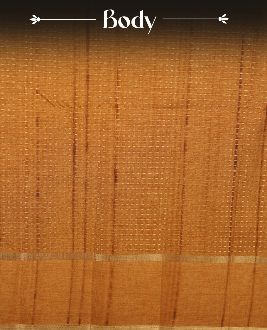 Antique gold colour semi tussar silk saree highlighting gold zari dotted stripes, self colour border and contrast dark gold pallu and comes with matching blouse piece.