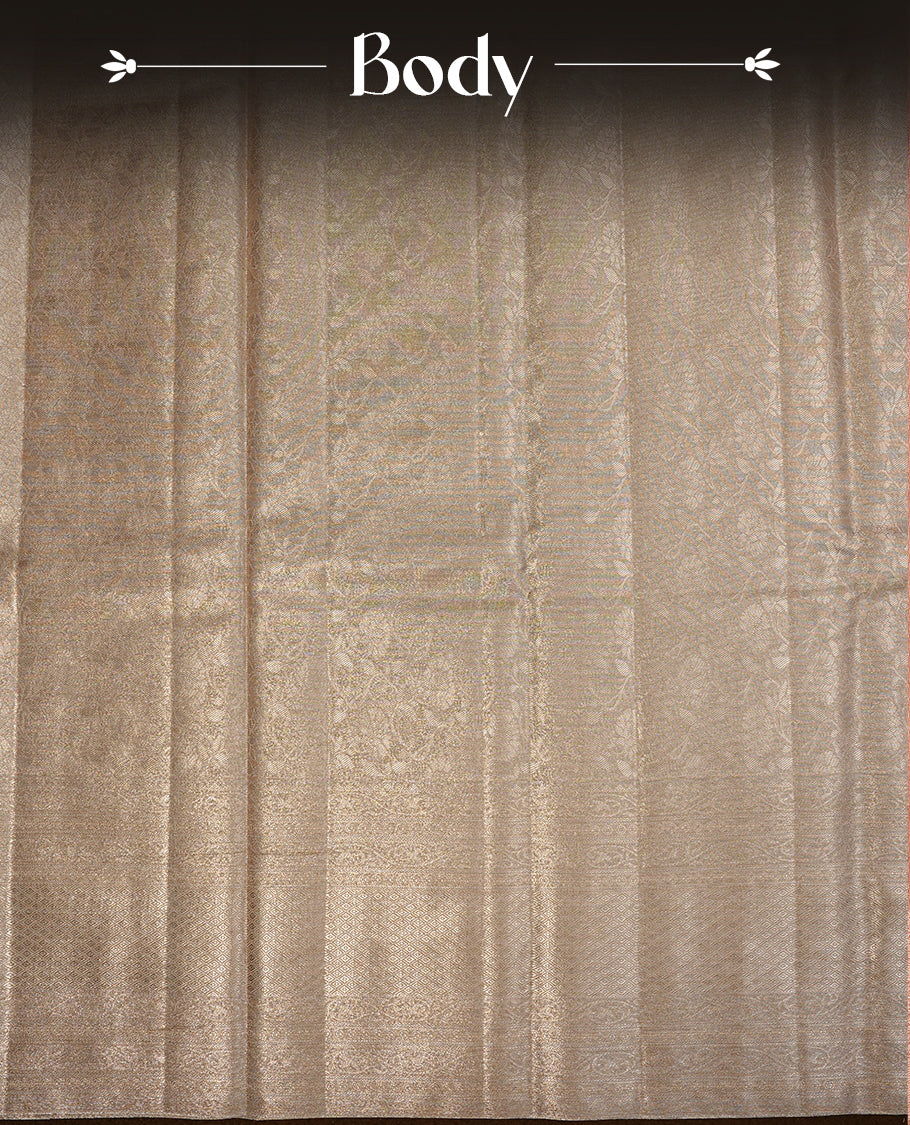 Light Gold colour semi tissue silk saree featuring gold zari pattern on body, self colour with gold zari traditional border, paired with matching blouse piece.