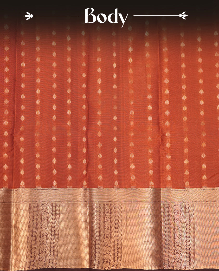 Burned orange colour Soft silk saree featuring gold zari motifs on the body, complemented by a contrast chocolate brown traditional zari border and pallu, paired with a matching blouse piece.