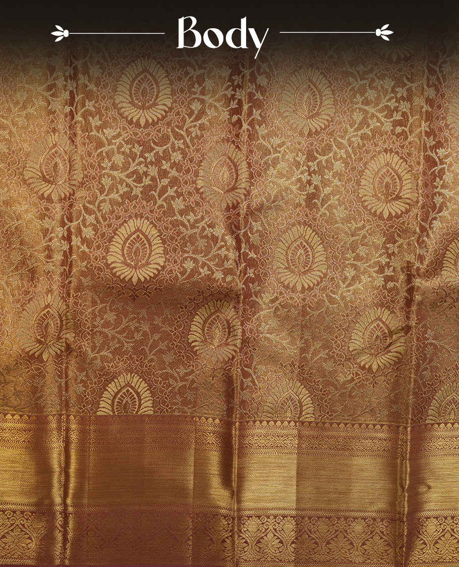 Pinkish beige & goldcolour kancheepuram tissue silk saree highlighting gold floral zari pattern body, with contrast Pinkish beige colour colour with traditional border and paired with matching blouse.