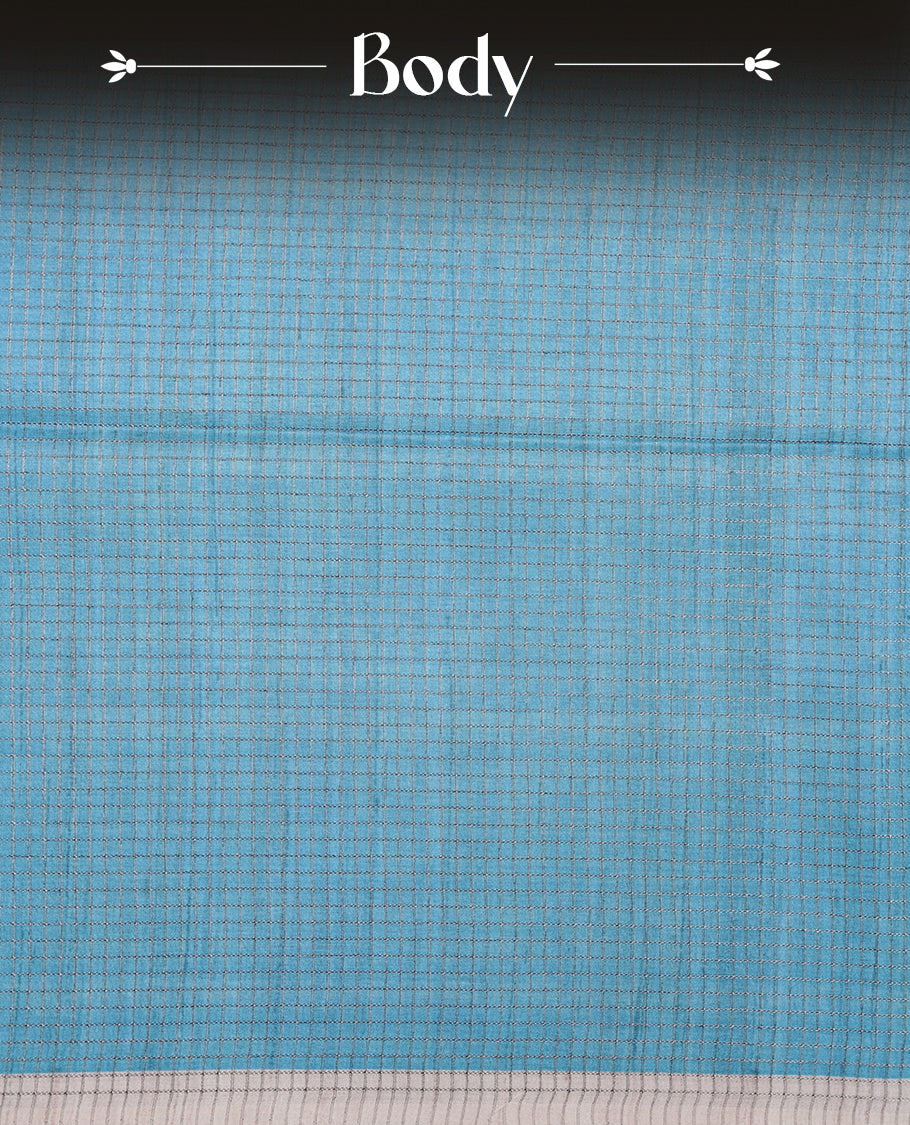 Sky-blue and off-white colour semi tussar silk saree featuring an all-over elephant motif print across the body, complemented by a contrasting blue pallu and border, and paired with a matching blouse piece.