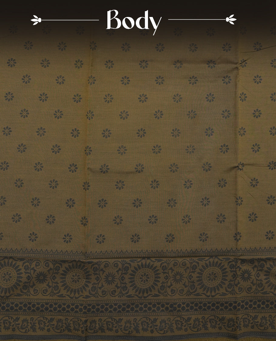 Dark Brown colour poly cotton saree with black floral butti motifs on the body, paired with a matching pallu featuring black ornate floral jaal and stripes on the border, and a coordinated all‑over black paisley printed blouse piece.