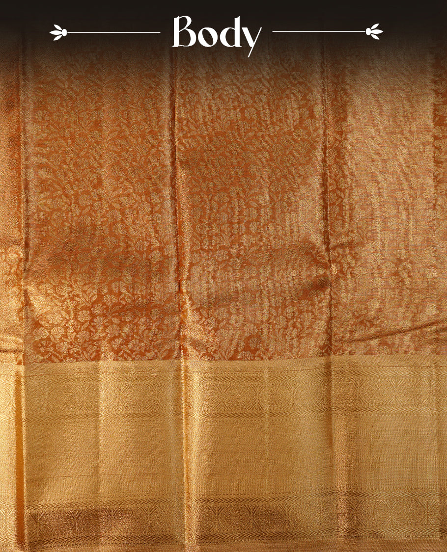 Gold colour semi tissue silk saree featuring gold zari pattern on body, self colour with gold zari traditional border, paired with matching blouse piece.