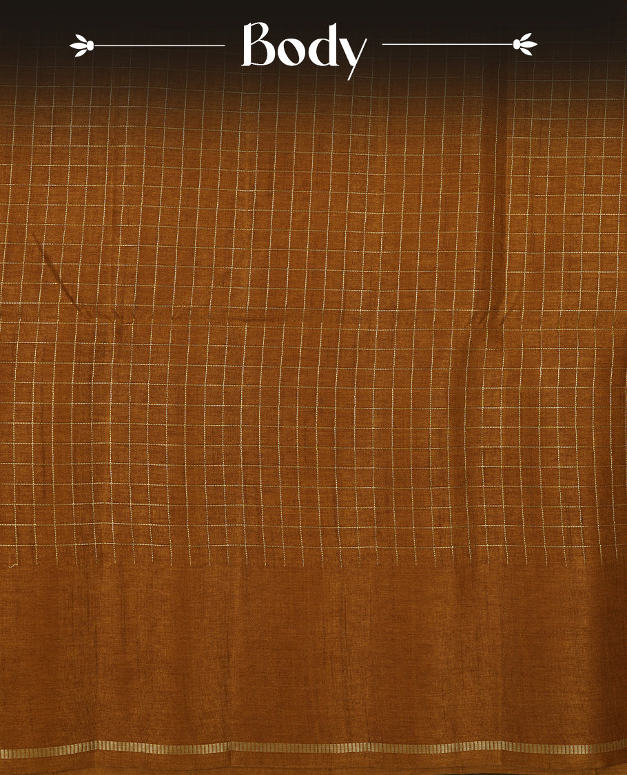 Brown colour semi Tussar saree highlights gold zari check pattern across body, border, pallu and paired with matching blouse piece.