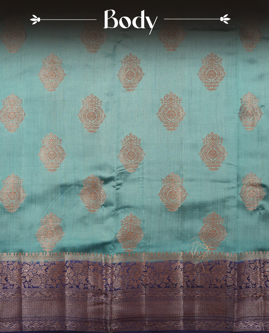 Aqua blue Banaras soft silk saree with gold zari motifs on body, with contrast Dark blue colour floral pattern on pallu, border, and Matching blouse.