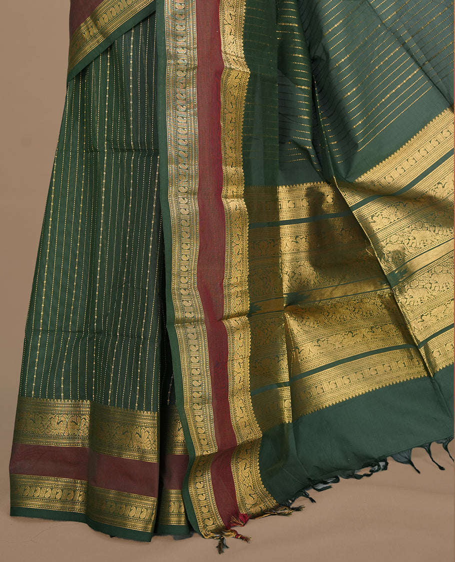 Green colour chettinad cotton saree featuring gold zari stripes on body, complemented by gold zari with maroon border, paired with matching blouse piece.