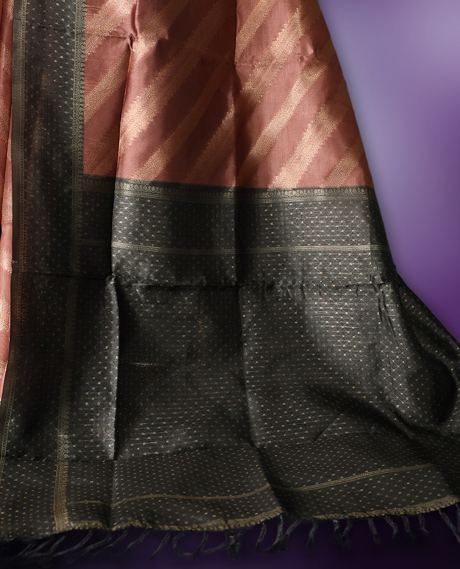 Golden Peach colour saree featuring subtle self striped woven patterns on the body, enhanced with a olive green geometric border, complemented by a rich zari pallu with tassels, and paired with a matching blouse for a traditional elegant look.
