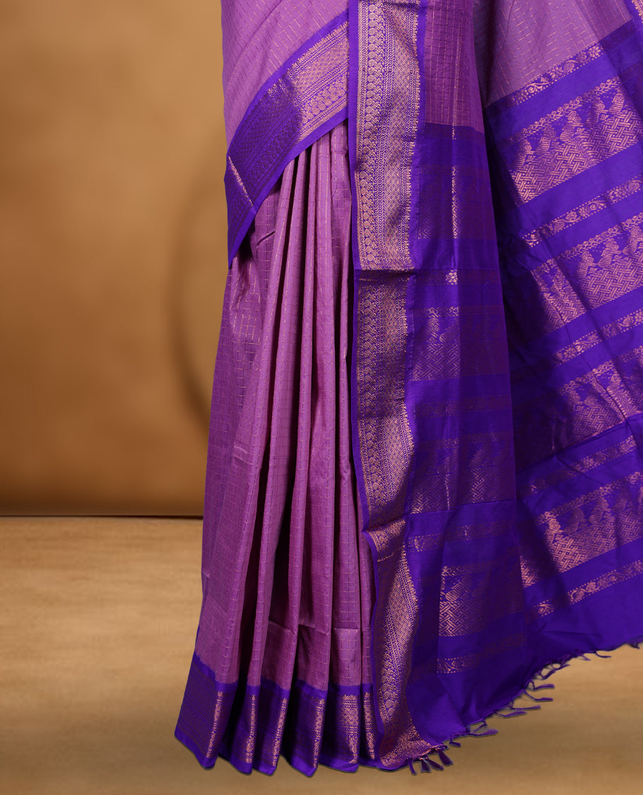 Lavender colour kalyani cotton saree featuring Antique zari check pattern on body, contrast Indigo colour border with antique zari pattern, paired with matching blouse piece.