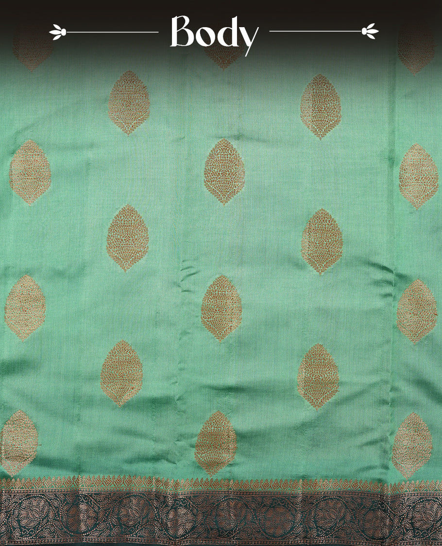 Aqua green Banaras soft silk saree with gold zari oval motifs on body, with contrast Dark Teal colour floral pattern on pallu, border, and Matching blouse.