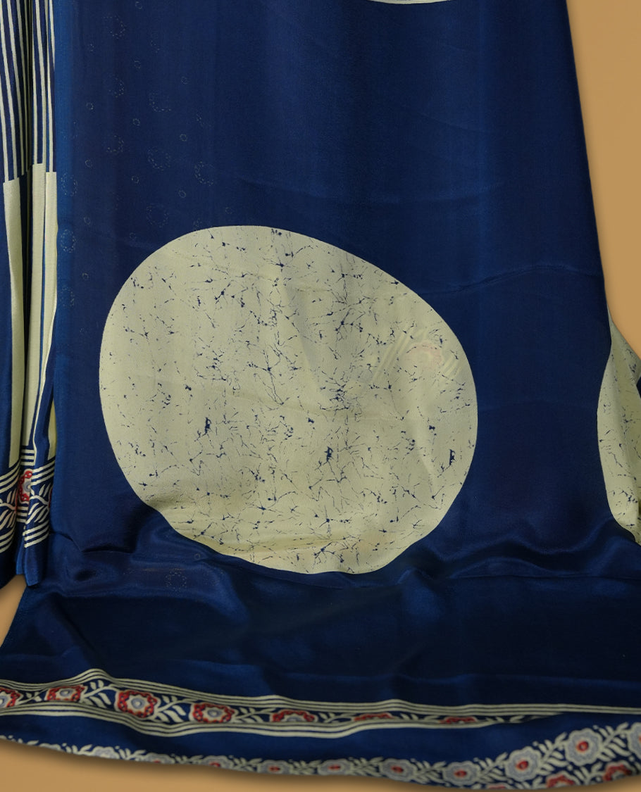 Navy blue and cream colour saree with fine vertical stripes and traditional floral borders & A bold circular motif enhances the pallu, giving it a contemporary twist, Lightweight and graceful, paired with matching blouse.