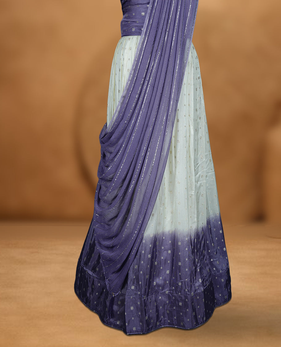 Off white semi banaras semi stitched dhavani set featuring gold zari motifs and contrast Lavender colour border, unstitched gold zari blouse piece and matching Duptta with gold zari stripes.