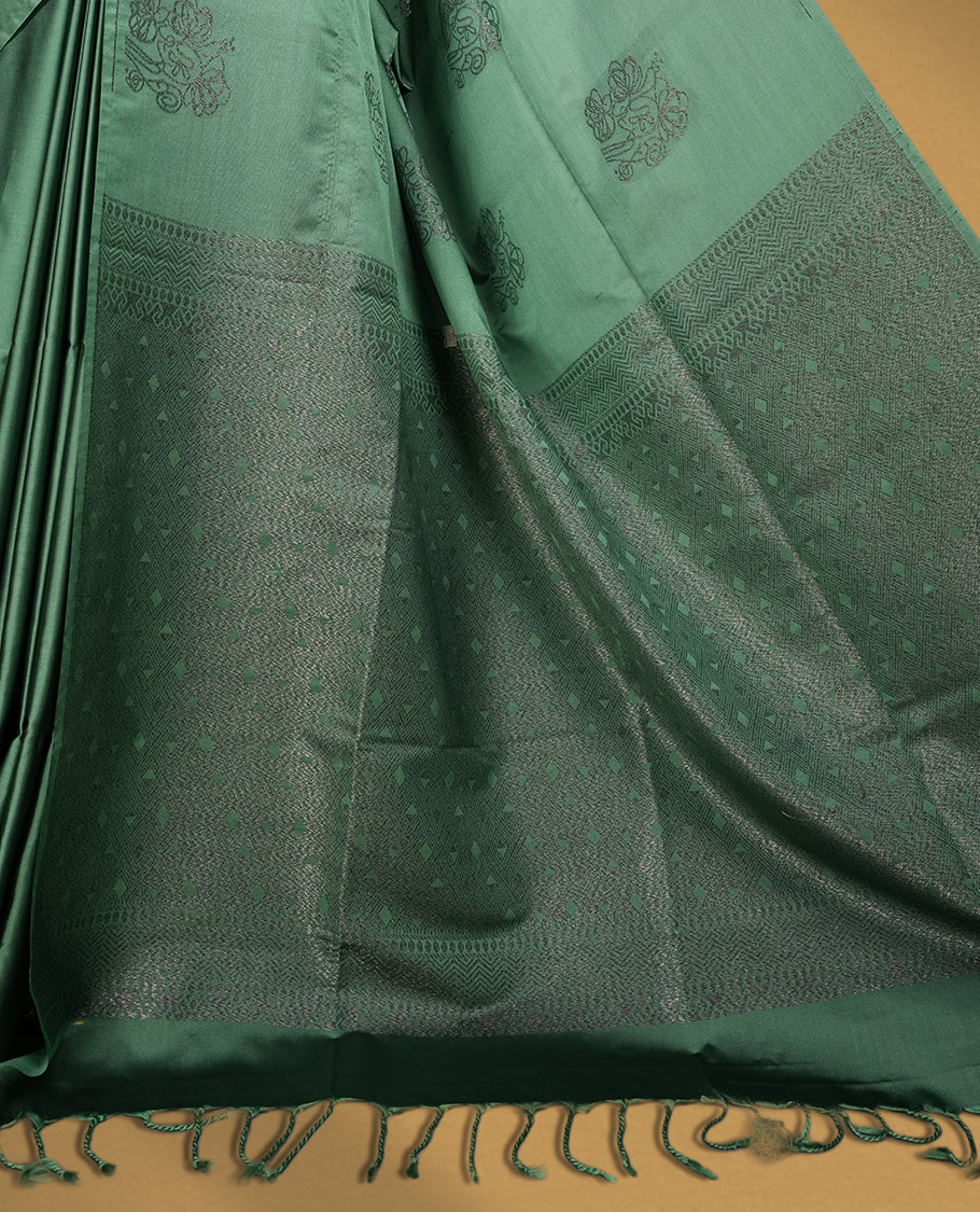 Soft aqua green colour semi soft silk saree featuring self woven motifs on the body, elegant woven border, and rich matching pallu with tassel finish & Comes with a coordinating blouse piece for a graceful look.