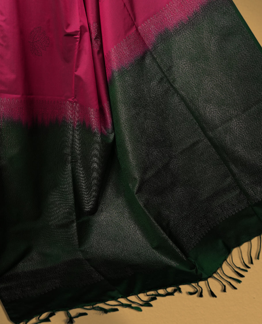 Burgundy colour semi soft silk saree, beautifully designed with woven leaf motifs & The look is enhanced by a rich contrast green pallu, paired with a matching blouse.
