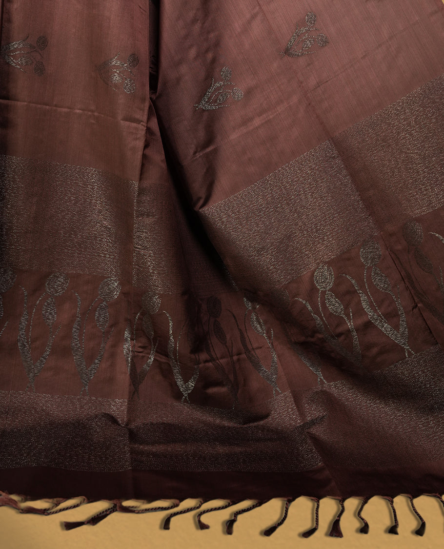 Brown colour semi soft silk saree with delicate woven motifs on the body, complemented by a beautifully designed pallu with tassels & Paired with a matching blouse piece, this drape exudes timeless elegance.