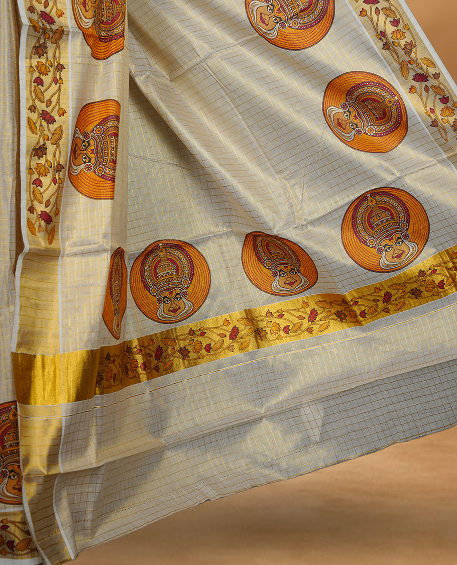Light gold colour Tissue Kerala saree featuring a gold zari check pattern body, an intricately woven gold traditional border with floral and Indian art form print paired with a matching blouse.