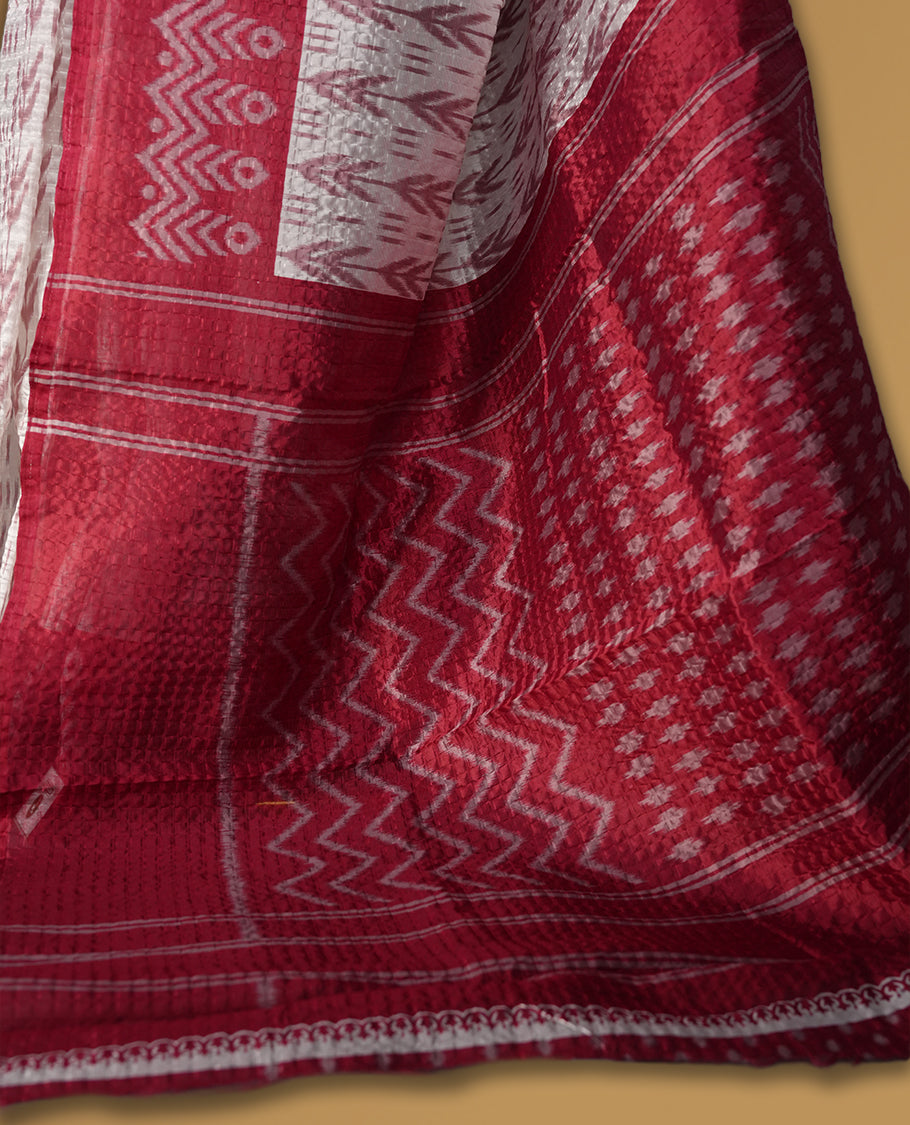 Classic off white colour saree adorned with intricate maroon tribal motifs and rich woven patterns on the pallu and border & Paired with matching blouse.