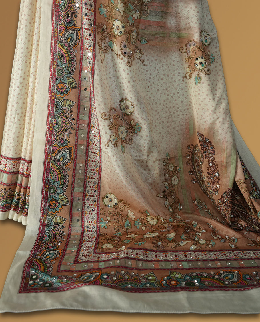 Off white colour saree with subtle polka dots, adorned with ornate multicolored borders and a traditional paisley pallu & Paired with a matching blouse.