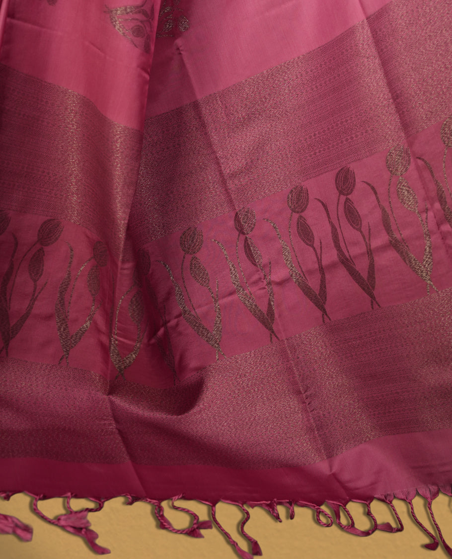 Soft pink colour semi soft silk saree, adorned with subtle woven floral motifs on the body & The design is elevated with an elegant zari border and pallu with tassels, paired with a matching blouse.