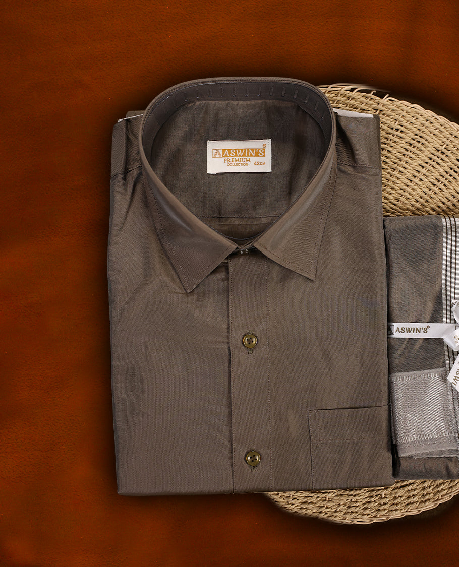 Copper colour Aswin’s wedding set featuring a premium silk finish full sleeve shirt, paired with a matching dhoti and angavastram accented with elegant silver zari work, ideal for festive and wedding occasions