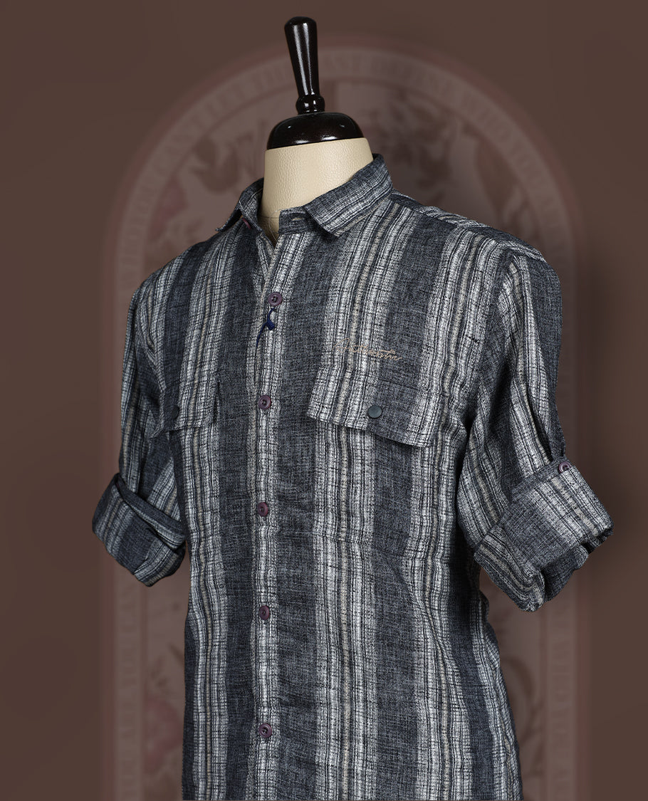 Charcoal black colour cotton linen blended shirt featuring self striped detailing and a breathable textured weave, Designed with double flap chest pockets, roll up sleeves, and a button-down front.