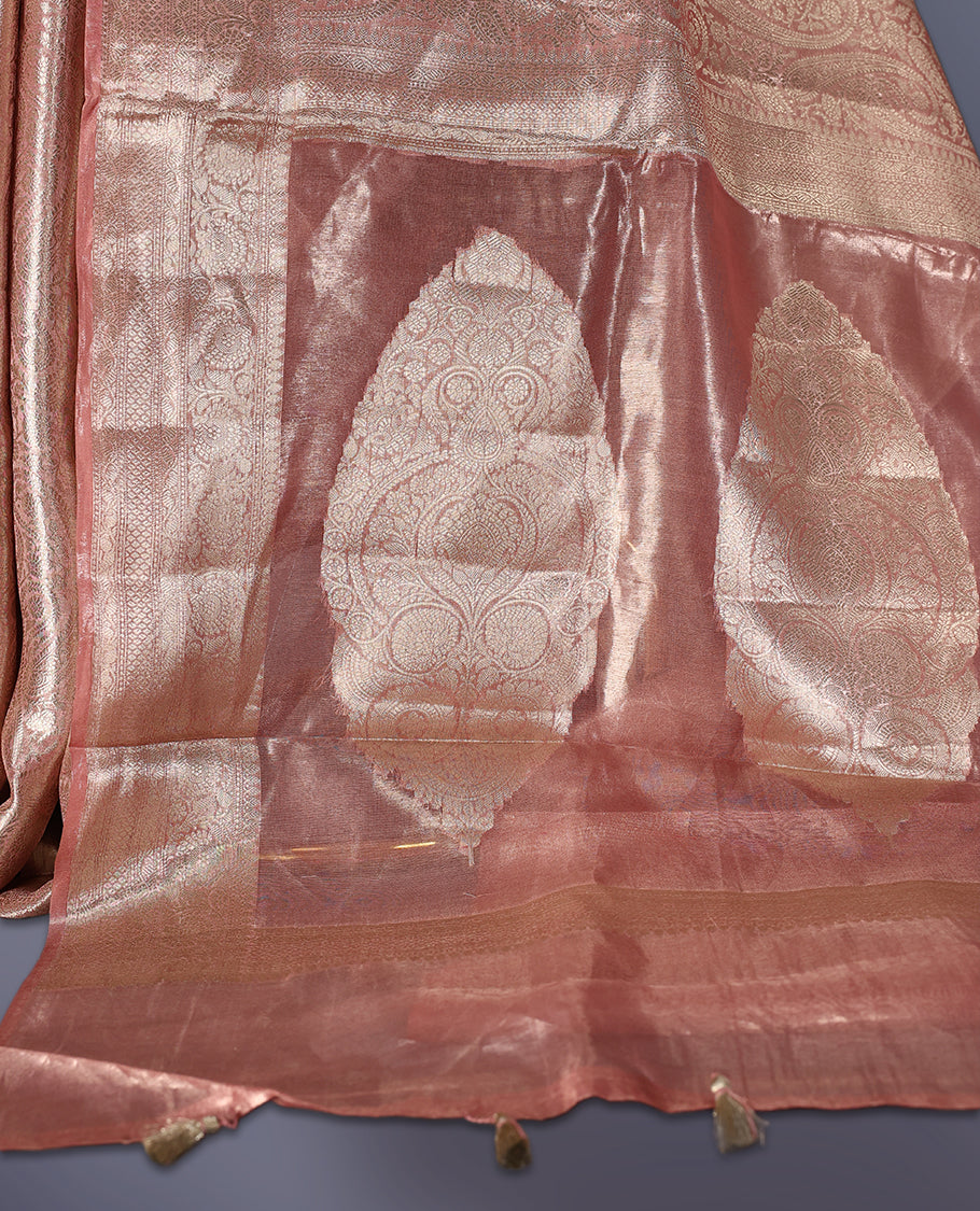 Pastel Onion colour Pure tissue Banaras saree featuring intricate silver zari weaving all over with a rich pallu and bold paisley motifs, offering a luxurious drape perfect for weddings, festive occasions, and grand celebrations
