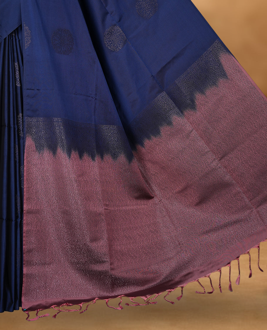 Navy blue colour soft silk saree featuring Antique zari motifs on body with Highlighting contrast Pink colour pallu and paired with matching blouse piece.