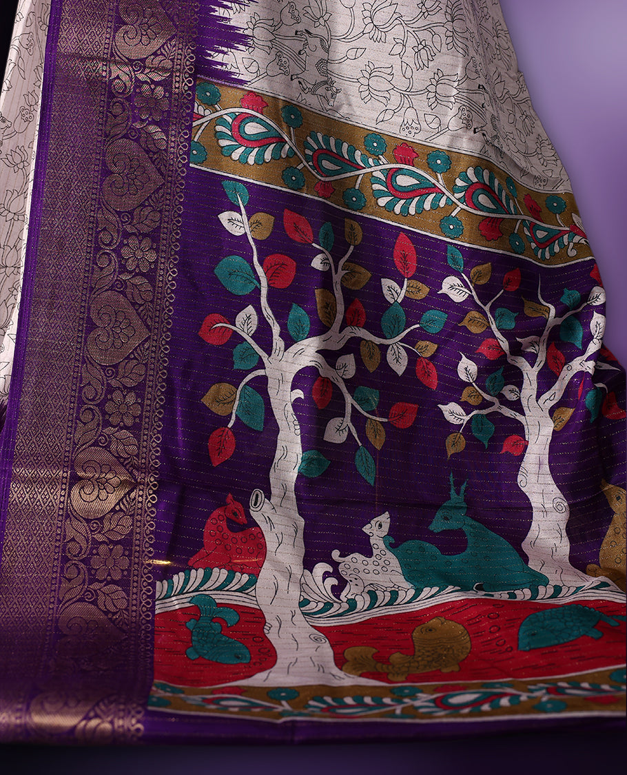 White saree featuring intricate line art motifs all over, elevated with a rich purple and gold zari border & The pallu showcases vibrant multicolor animal and tree designs, paired with a matching blouse.