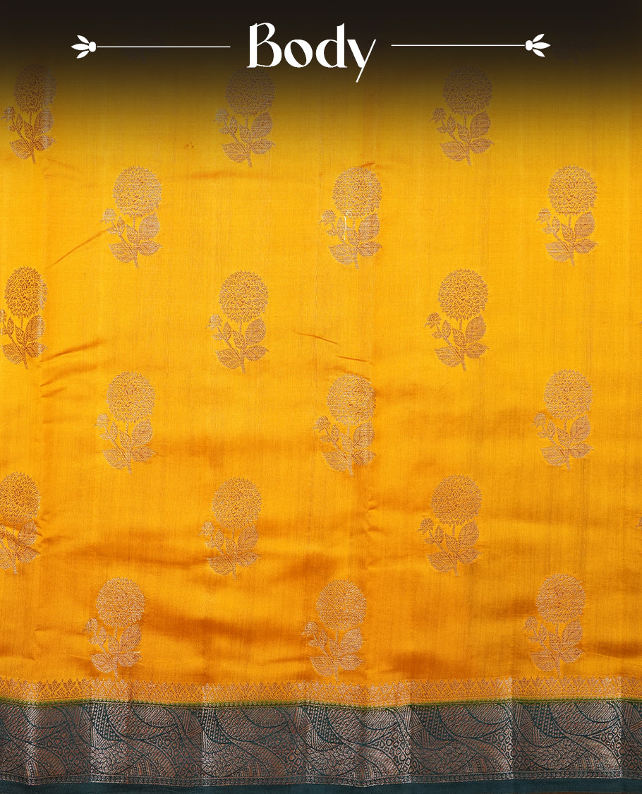 Mustard Colour Pure Banaras soft Silk Saree having gold floral motifs on Body with contrast Dark teal colour gold zari Border and matching Blouse