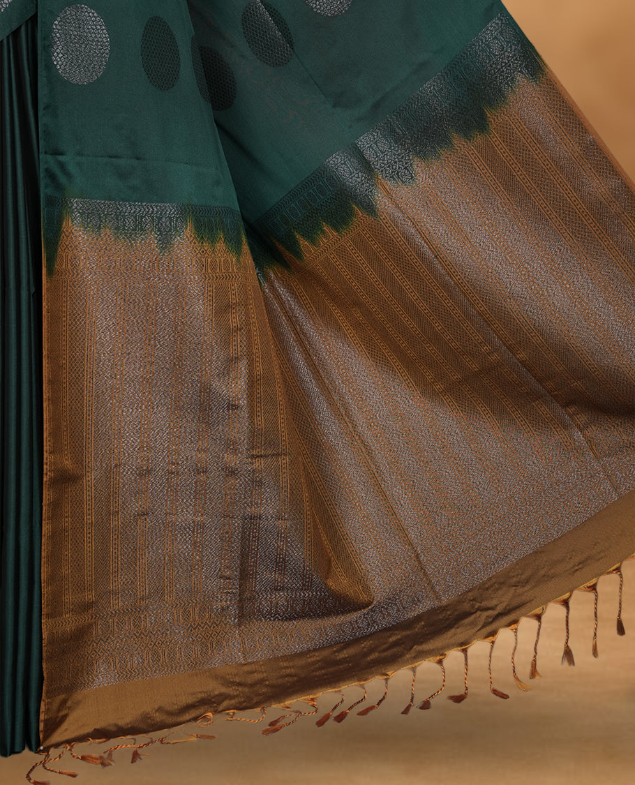 Green colour soft silk saree featuring Antique zari motifs on body with Highlighting contrast Mustard colour pallu and paired with matching blouse piece.