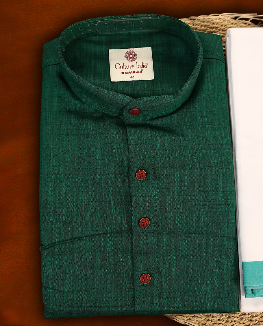 RAMRAJ Dark green kurtha paired with a white dhoti, elegantly finished with a matching dark green border.