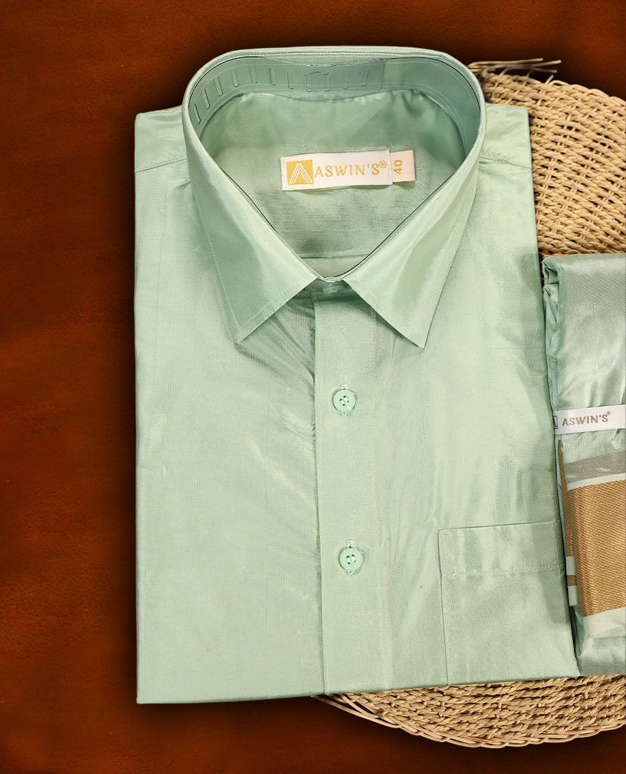 Pista green colour Aswin's wedding set featuring a shiny silk finish full sleeve shirt, paired with a matching pista green dhoti adorned with a rich golden zari border, perfect for weddings and festive occasions.