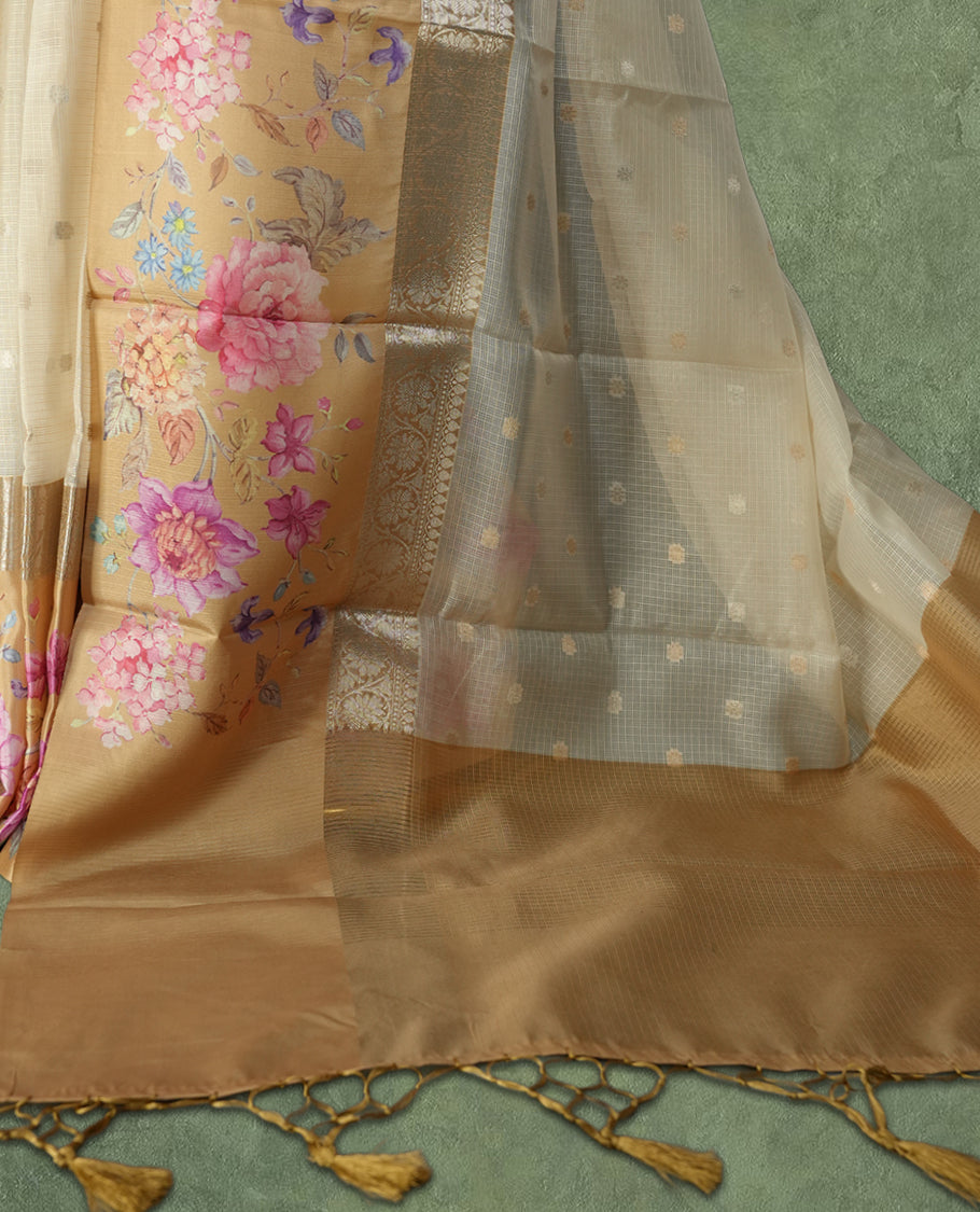 Ivory colour Kotta Tussar Silk saree features a vibrant digital floral print with small gold zari motifs on the body, and elegant banarasi border adds a regal touch & Paired with a matching blouse,blending modern design with traditional elegance.