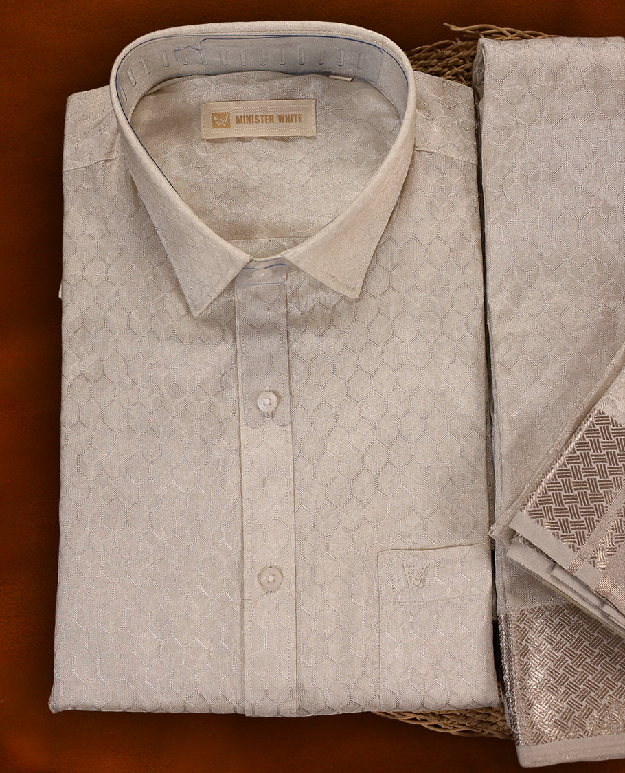 White silver colour MINISTER WHITE jacquard shirt with an all over textured weave, paired with a matching silver zari bordered dhoti featuring intricate geometric patterns, perfect for a refined traditional look.