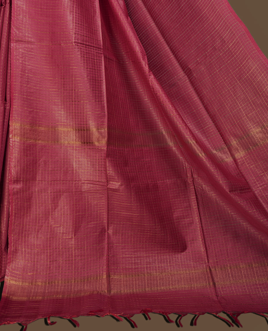 Medium maroon colour semi jute saree with golden checked body for a traditional appeal, Soft texture, tassel pallu, and Includes matching blouse piece for a complete look.