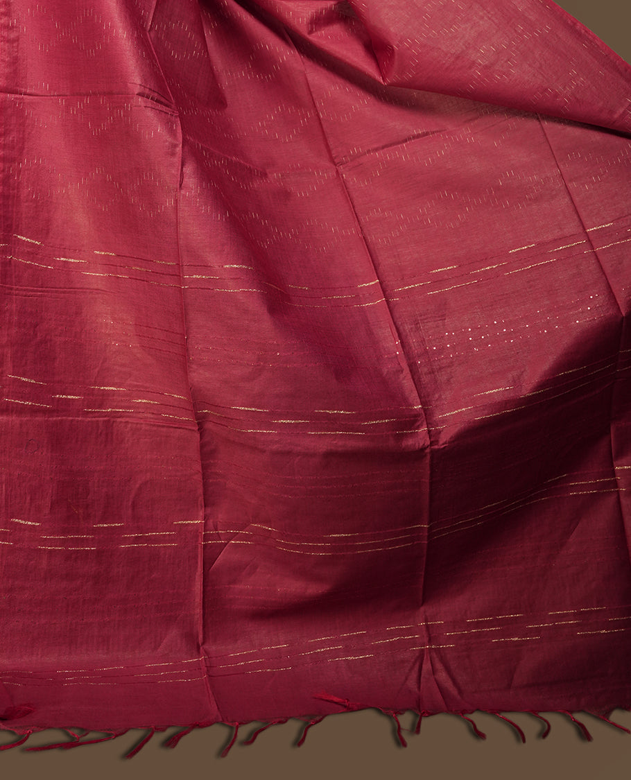 Crimson red colour semi jute saree featuring subtle linear woven motifs across the body, Enhanced with a finely crafted pallu and sleek border & Comes with a matching blouse piece for a complete look.