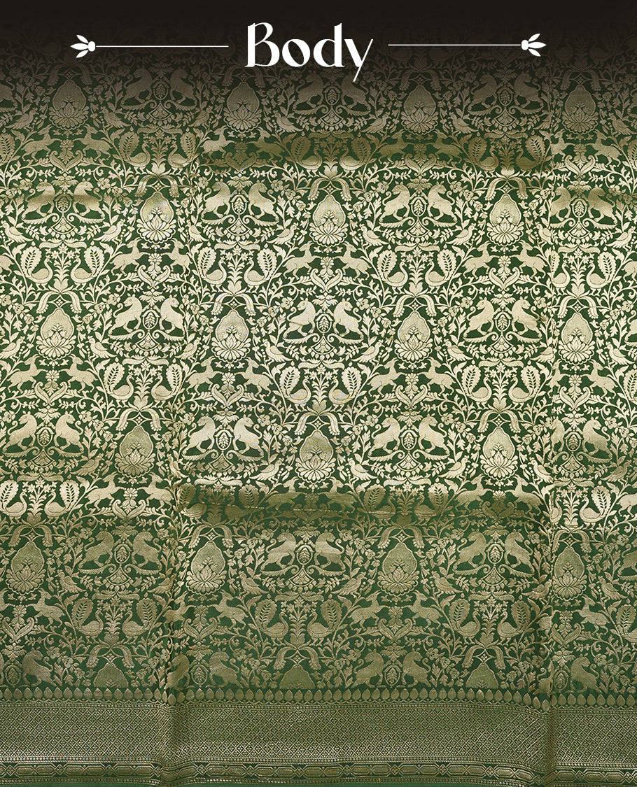 Dark Green colour Mysore Crepe Silk saree fearturing gold Zari kodi visiri & Animal brocade pattern on body and self colour border paired with matching blouse