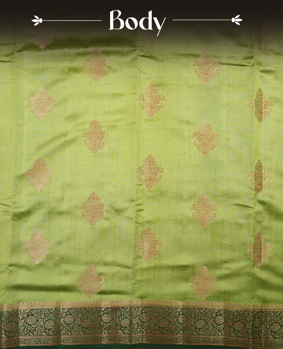 Green Banaras soft silk saree with gold zari motifs on body, with contrast Dark green colour floral pattern on pallu, border, and Matching blouse.