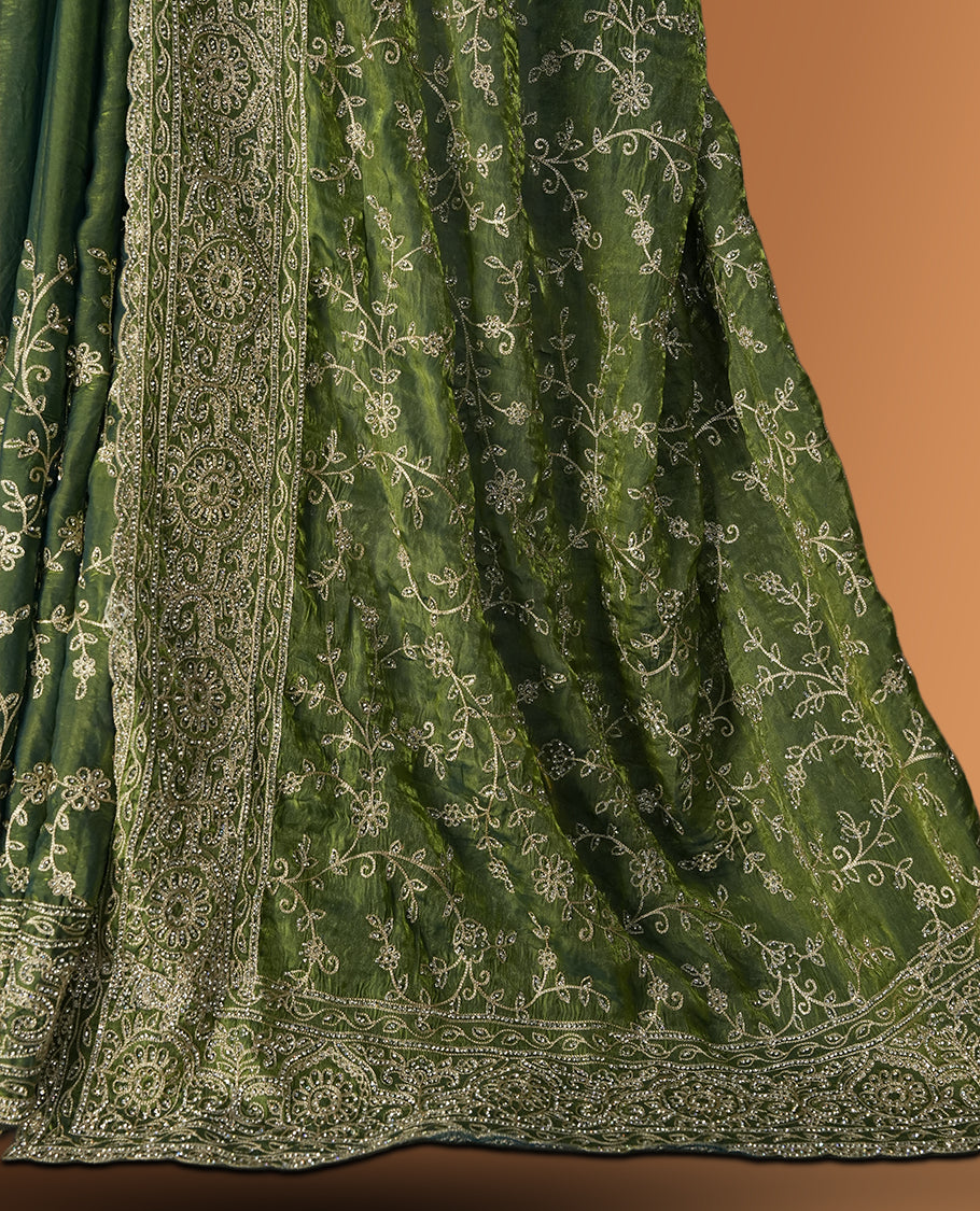 Pista green colour velvet chiffon designer saree in elegant two tone shades, featuring light gold zari, kodi work with handwoven style thread aari & dori embroidery work, Swarovski stone work and all over motifs, comes with matching blouse.