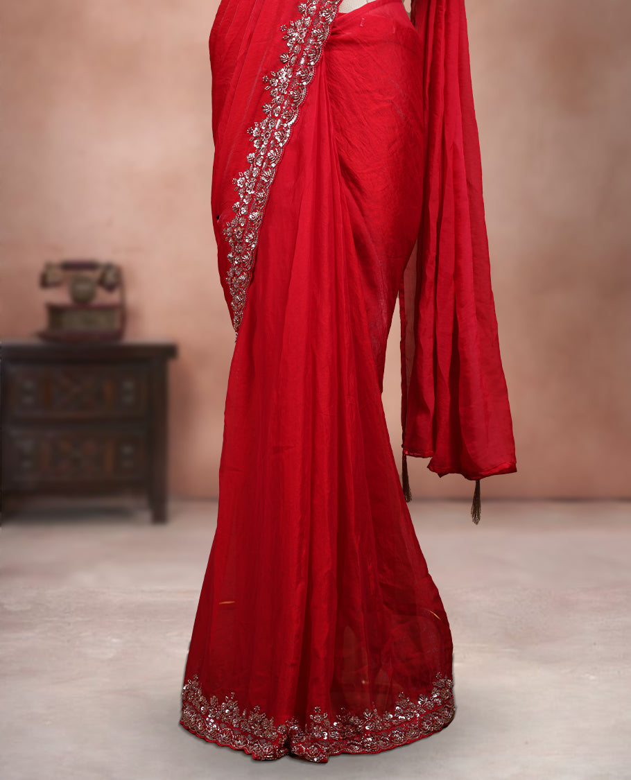 Elegant Deep Red ready to wear saree adorned with rich silver zari and bead embroidery along the border and pallu, paired with a heavily embellished matching blouse for a grand festive look.