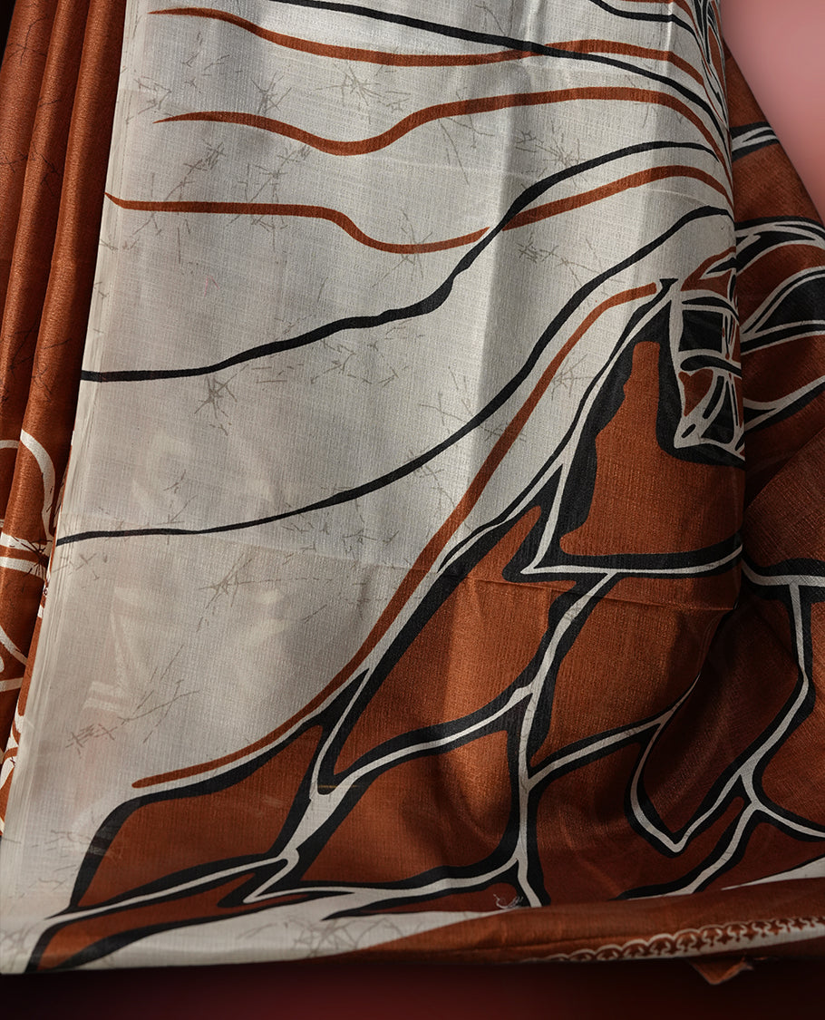 Brown and off white colour saree featuring bold abstract floral patterns, blending contemporary black colour design with ethnic elegance & paired with a matching blouse.