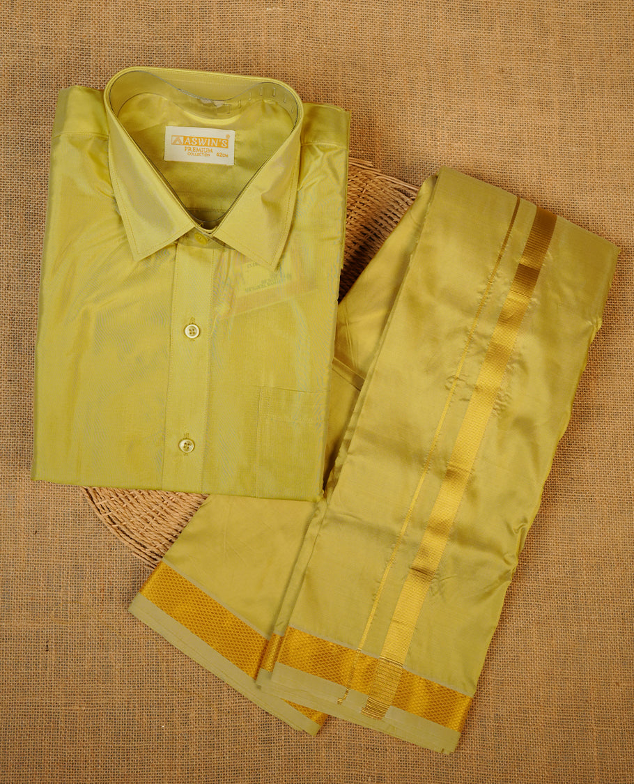 Gold colour shirt and dhoti with gold colour border, paired with matching colour silk saree featuring gold zari buttas and traditional border paired with matching blouse piece.